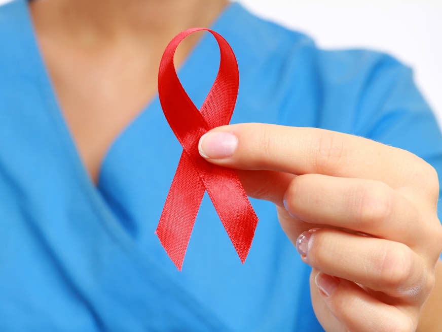 Nurse with  aids ribbon, isolated on white background