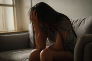 192314369-sad-woman-sitting-in-the-room